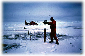Tim Buckley, Barrow High School science teacher, drills an ice core while on helocopter recon during AWS96.